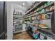 Walk-in pantry featuring shelves for storage, providing ample space at 3647 Glen Haven Sw Dr, Concord, NC 28027
