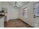 Dining area with hardwood floors, modern chandelier, and natural light at 3753 Capps Hill Dr, Charlotte, NC 28216