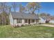 Charming single-story home with manicured lawn and inviting front porch at 3753 Capps Hill Dr, Charlotte, NC 28216