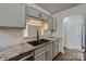 Modern kitchen with granite countertops, updated cabinets and stainless steel appliances at 3753 Capps Hill Dr, Charlotte, NC 28216