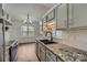 Lovely kitchen with granite countertops, stainless steel appliances and a black, double sink at 3753 Capps Hill Dr, Charlotte, NC 28216
