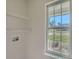 Functional laundry room with shelving and a bright window at 3753 Capps Hill Dr, Charlotte, NC 28216