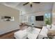 Bright living room with hardwood floors, white sofa, dining area, and modern decor at 3753 Capps Hill Dr, Charlotte, NC 28216