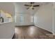 Spacious living room with hardwood floors, ample natural light, and open layout at 3753 Capps Hill Dr, Charlotte, NC 28216