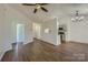 Open-concept living room with hardwood floors and an easy transition to the kitchen at 3753 Capps Hill Dr, Charlotte, NC 28216