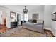 Cozy bedroom with a daybed, stylish accents, and an adjacent bathroom entrance at 411 Walnut St, Davidson, NC 28036