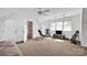Versatile bonus room with exercise equipment, a tv and plenty of open space at 411 Walnut St, Davidson, NC 28036