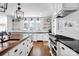 Bright kitchen with a butcher block island, stylish fixtures, and a professional range at 411 Walnut St, Davidson, NC 28036