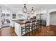 Spacious kitchen featuring a center island with seating and stainless steel appliances at 411 Walnut St, Davidson, NC 28036
