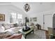 Bright and open living room with large windows, plush seating, and ample natural light at 411 Walnut St, Davidson, NC 28036