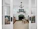 Elegant living room featuring a decorative fireplace, hardwood floors, and ample natural light at 411 Walnut St, Davidson, NC 28036