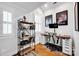 Bright office space with hardwood floors, a modern desk, and ample shelving at 411 Walnut St, Davidson, NC 28036