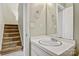 Cozy bathroom featuring a vanity with sink and mirror adjacent to a stairway at 4340 N Center Ne St # 508, Hickory, NC 28601