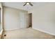 This bedroom features neutral walls and carpet, ceiling fan, and door to bathroom at 4340 N Center Ne St # 508, Hickory, NC 28601