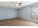Serene bedroom with a calming blue color scheme, plush carpet, and natural light at 4340 N Center Ne St # 508, Hickory, NC 28601