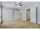 This bedroom features a ceiling fan, multiple closets and a view of the attached bathroom at 4340 N Center Ne St # 508, Hickory, NC 28601