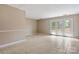 Bright and airy living room with tiled floor and glass French doors leading to the outside at 4340 N Center Ne St # 508, Hickory, NC 28601