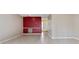 Spacious living room featuring tiled floors, neutral walls, with a red accent wall at 4340 N Center Ne St # 508, Hickory, NC 28601