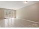 Bright and airy living room with tiled floor and glass French doors leading to the outside at 4340 N Center Ne St # 508, Hickory, NC 28601