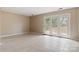 Bright and airy living room with tiled floor and glass French doors leading to the outside at 4340 N Center Ne St # 508, Hickory, NC 28601