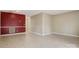 Spacious living room featuring tiled floors, neutral walls, with a red accent wall at 4340 N Center Ne St # 508, Hickory, NC 28601