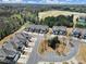 Beautiful aerial view of townhomes and neighborhood with lush landscaping and a golf course at 45008 Wigeon Ln # 101, Indian Land, SC 29707