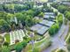 Aerial shot showcasing the tennis courts, bocce ball, and lush green landscape at 45008 Wigeon Ln # 101, Indian Land, SC 29707