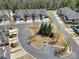 Aerial of modern townhomes, manicured yards, and tree-lined streets in a community at 45008 Wigeon Ln # 101, Indian Land, SC 29707