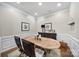 Light dining room featuring a wooden table with seating for four and a sideboard at 45008 Wigeon Ln # 101, Indian Land, SC 29707