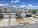 Street view of townhomes featuring attached garages, neat landscaping, and well-kept lawns at 45008 Wigeon Ln # 101, Indian Land, SC 29707