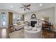 Bright and inviting living room featuring hardwood floors, fireplace, ample seating, and a neutral color palette at 45008 Wigeon Ln # 101, Indian Land, SC 29707