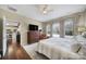 Spacious main bedroom offering a ceiling fan, a TV, and plenty of natural light at 45008 Wigeon Ln # 101, Indian Land, SC 29707