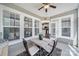 Charming screened-in porch with a table for four and views of the backyard at 45008 Wigeon Ln # 101, Indian Land, SC 29707