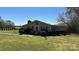 Single-story home with a chimney, front lawn, and a welcoming entrance at 4807 Lon Parker Rd # 1, Waxhaw, NC 28173