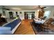 Open-concept living area with hardwood floors and a dining set at 4807 Lon Parker Rd # 1, Waxhaw, NC 28173