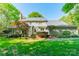 Well-manicured backyard with mature trees at 5232 Silchester Ln, Charlotte, NC 28215