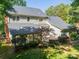 Aerial view of backyard with a patio and mature trees at 5232 Silchester Ln, Charlotte, NC 28215