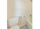 Bathroom featuring a toilet and tub with white tiles and blue floor tiles at 5232 Silchester Ln, Charlotte, NC 28215
