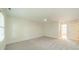 Neutral bedroom featuring carpet, a ceiling fan, and an ensuite bathroom at 5232 Silchester Ln, Charlotte, NC 28215