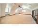 Spacious bonus room with windows and carpet at 5232 Silchester Ln, Charlotte, NC 28215