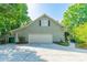 Spacious garage with ample parking, a well-maintained exterior, and a convenient side entry door at 5232 Silchester Ln, Charlotte, NC 28215