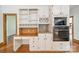 Kitchen with a built-in desk and stainless steel appliances at 5232 Silchester Ln, Charlotte, NC 28215