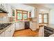 Bright kitchen featuring stainless steel appliances, granite counters and white cabinets at 5232 Silchester Ln, Charlotte, NC 28215