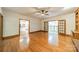 Open-concept living room featuring hardwood floors and glass doors that bring in natural light at 5232 Silchester Ln, Charlotte, NC 28215