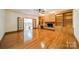 Spacious living room with beautiful hardwood floors, a brick fireplace and built-in bookshelves at 5232 Silchester Ln, Charlotte, NC 28215
