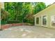 Concrete patio featuring brick wall at 5232 Silchester Ln, Charlotte, NC 28215