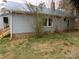 The home's exterior features light blue siding and mature trees surrounding the property at 526 Peaceful Leaf Ln, Kings Mountain, NC 28086