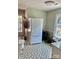 Bright kitchen featuring patterned floors, a modern refrigerator, and an adjacent window with natural light at 7412 Broken Oak Ln, Charlotte, NC 28226
