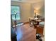 Comfortable office space featuring hardwood floors, a wooden desk, and a window view at 7412 Broken Oak Ln, Charlotte, NC 28226