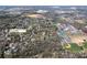 Aerial view of the neighborhood, highlighting the property's location in a residential area near schools and other facilities at 880 Craigmont Nw Ln, Concord, NC 28027